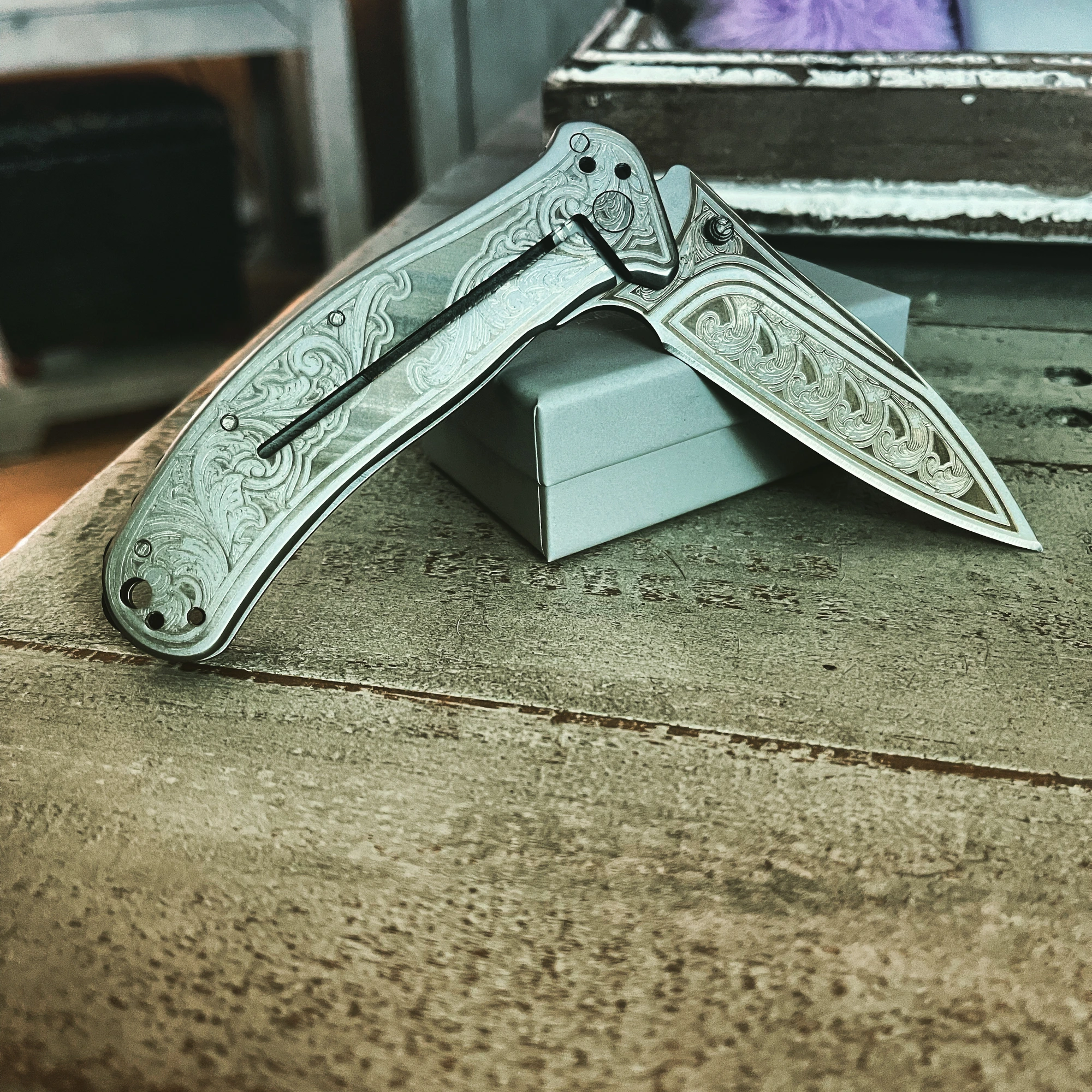 Scroll-Engraved Folding Knife